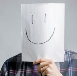 testimonial man with smiling face in front of his face